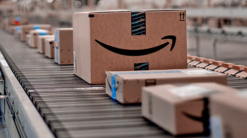 Amazon boxes in fulfillment center on a conveyor belt