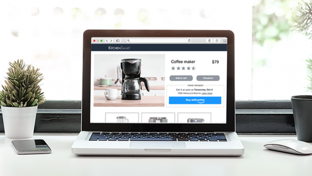 Open laptop on a desk featuring Buy with Prime checkout screen