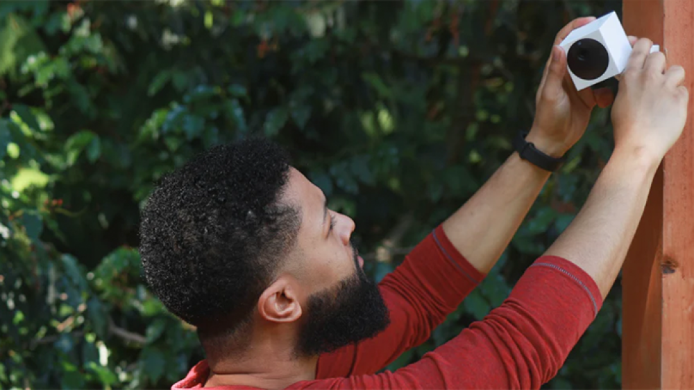 Image of a man installing a Wyze camera